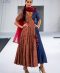 Kalamkari angrakha with munga checks and handmade tassles, teamed up with organza duppatta with aari work.