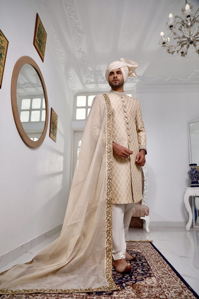 Champagne Gold Sherwani Paired With Matching Inner Suit And Turban
