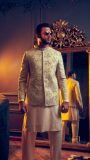 Cream shalwar kurta paired with a beige embroidered bundgalla short jacket