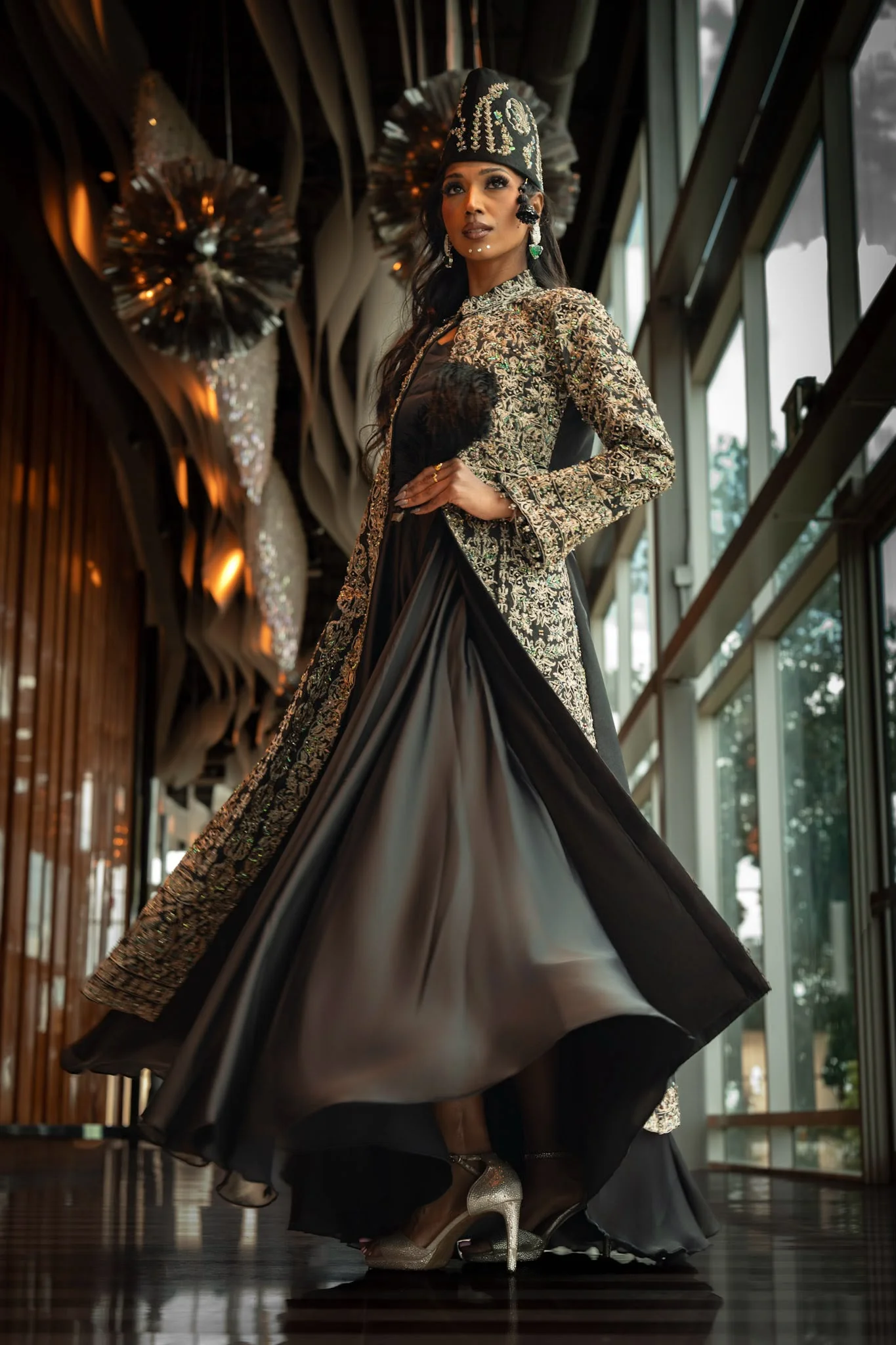Black flowing gown with heavily embellished long jacket