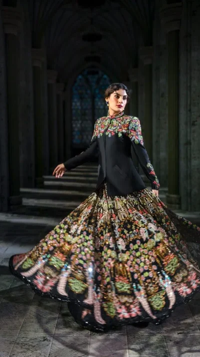 Black jacket with vibrant multicoloured floral embroidery and printed flared skirt