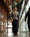 Black men's embroidered short jacket with draped trousers
