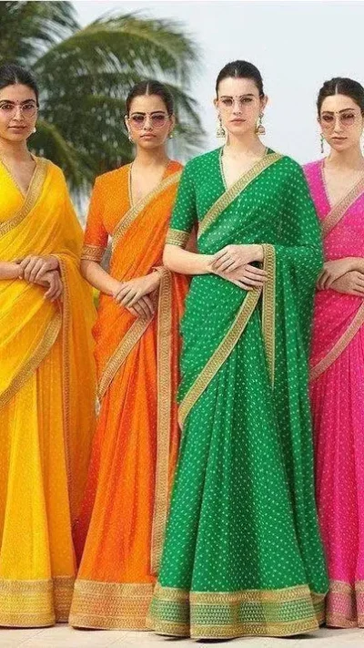 Four sarees in yellow, orange, green and pink