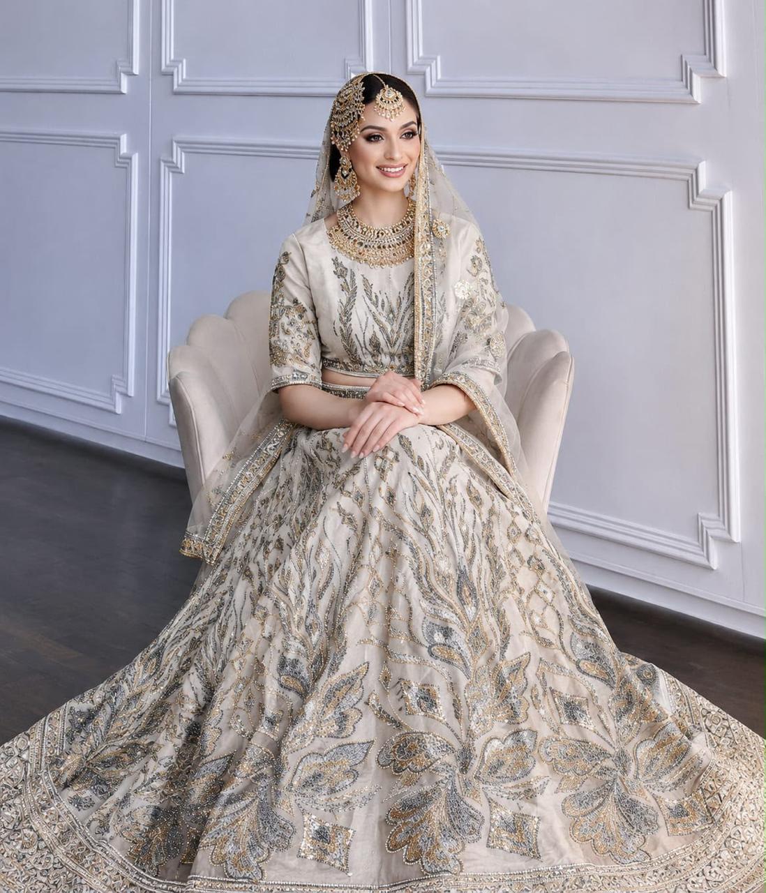 Ivory lehenga with intricate gold and silver embroidery