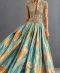 Soft aqua-blue and gold printed gown with floral embroidered bodice